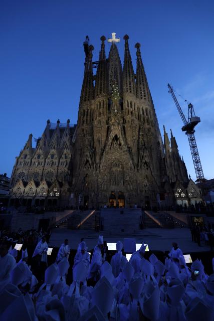 Bishops attend the inauguration of the Jesus Christ tower by Pope Leo XIV, outside of the Basilica of the Sagrada Familia, in Barcelona, on June 10, 2026. Pope Leo XIV is visiting Spain June 6-12 with stops in Madrid, Barcelona, and the Canary Islands, where he will meet with migrants and organisations dedicated to helping them. (Photo by Lluis GENE / AFP)