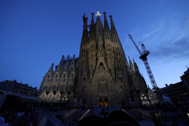Bishops attend the inauguration of the Jesus Christ tower by Pope Leo XIV, outside of the Basilica of the Sagrada Familia, in Barcelona, on June 10, 2026. Pope Leo XIV is visiting Spain June 6-12 with stops in Madrid, Barcelona, and the Canary Islands, where he will meet with migrants and organisations dedicated to helping them. (Photo by Lluis GENE / AFP)