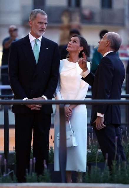 King Felipe VI (L) and Queen Letizia take their place to attend the inauguration of the Sagrada Famila Basilica's Jesus Christ tower by Pope Leo XIV in Barcelona, on June 10, 2026. Pope Leo XIV is visiting Spain June 6-12 with stops in Madrid, Barcelona, and the Canary Islands, where he will meet with migrants and organisations dedicated to helping them. (Photo by Josep LAGO / AFP)