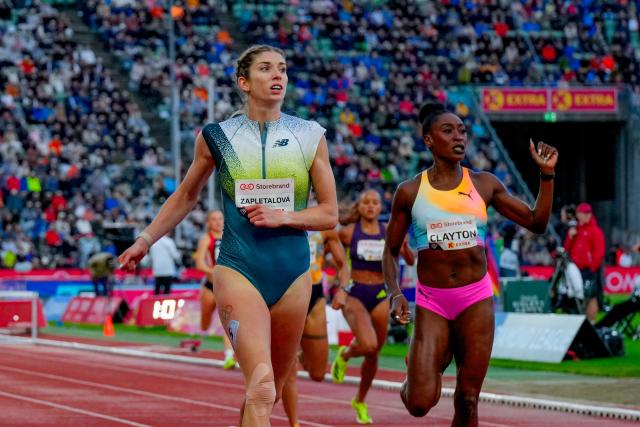 Slovakia's Emma Zapletalova (L) celebrates winning ahead of Jamaica's Rushell Clayton in the Women's 400m Hurdles event of the Olso Diamond League athletics meeting in Oslo, Norway, on June 10, 2026. (Photo by Heiko Junge / NTB / AFP) / Norway OUT