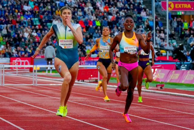 Slovakia's Emma Zapletalova (L) wins ahead of Jamaica's Rushell Clayton in the Women's 400m Hurdles event of the Olso Diamond League athletics meeting in Oslo, Norway, on June 10, 2026. (Photo by Heiko Junge / NTB / AFP) / Norway OUT