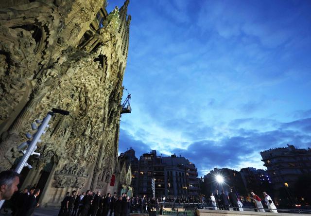 Pope Leo XIV (2R) inaugurates the Jesus Christ tower of the Sagrada Familia Basilica in Barcelona, on June 10, 2026. Pope Leo XIV is visiting Spain June 6-12 with stops in Madrid, Barcelona, and the Canary Islands, where he will meet with migrants and organisations dedicated to helping them. (Photo by Josep LAGO / AFP)