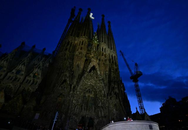 A photo taken in Barcelona, on June 10, 2026 shows a view of the Basilica of the Sagrada Familia during the inauguration of Jesus Christ tower by Pope Leo XIV (down). Pope Leo XIV is visiting Spain June 6-12 with stops in Madrid, Barcelona, and the Canary Islands, where he will meet with migrants and organisations dedicated to helping them. (Photo by Stefano RELLANDINI / AFP)