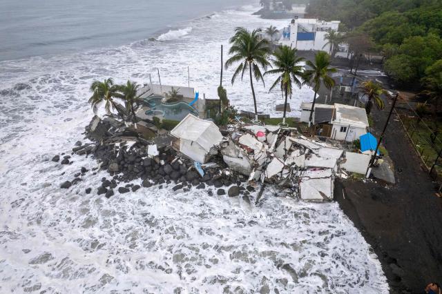 Aerial view show damage caused by rough seas ahead of the arrival of Storm Cristina in Iztapa, Guatemala on June 10, 2026. The countries of Central America remain on alert over the effects of Tropical Storm Cristina, which formed on June 8, 2026 in the Pacific Ocean, civil protection services reported. (Photo by Carlos ALONZO / AFP)