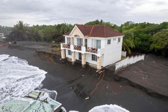 Aerial view show damage caused by rough seas ahead of the arrival of Storm Cristina in Iztapa, Guatemala on June 10, 2026. The countries of Central America remain on alert over the effects of Tropical Storm Cristina, which formed on June 8, 2026 in the Pacific Ocean, civil protection services reported. (Photo by Carlos ALONZO / AFP)