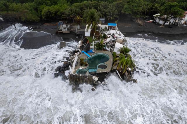 Aerial view show damage caused by rough seas ahead of the arrival of Storm Cristina in Iztapa, Guatemala on June 10, 2026. The countries of Central America remain on alert over the effects of Tropical Storm Cristina, which formed on June 8, 2026 in the Pacific Ocean, civil protection services reported. (Photo by Carlos ALONZO / AFP)