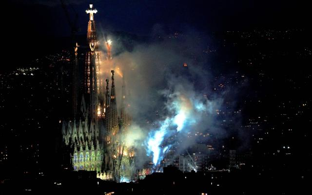 Fireworks are set off around the basilica of the Sagrada Familia after Pope Leo XIV blessed Jesus Christ tower during its inauguration in Barcelona, on June 10, 2026. Pope Leo XIV is visiting Spain June 6-12 with stops in Madrid, Barcelona, and the Canary Islands, where he will meet with migrants and organisations dedicated to helping them. (Photo by Manaure Quintero / AFP)