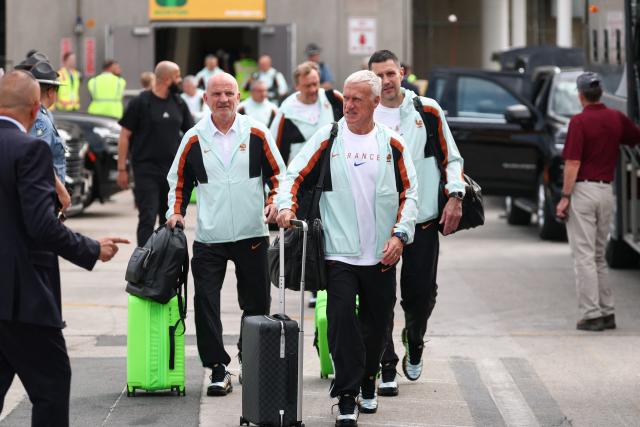 France's head coach Didier Deschamps (R) arrives at Logan Aeropuerto Internacional in Boston, Massachusetts on June 10 2026, ahead of the FIFA 2026 World Cup football tournament. (Photo by Franck FIFE / AFP)
