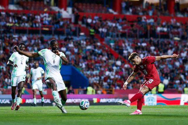 Portugal's midfielder #18 Pedro Neto (R) scores the opening goal during the international friendly football match between Portugal and Nigeria at Magalhaes Pessoa Stadium in Leiria, on June 10, 2026. (Photo by FILIPE AMORIM / AFP)