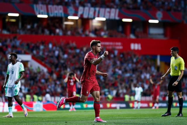 Portugal's midfielder #18 Pedro Neto celebrates scoring the opening goal during the international friendly football match between Portugal and Nigeria at Magalhaes Pessoa Stadium in Leiria, on June 10, 2026. (Photo by FILIPE AMORIM / AFP)