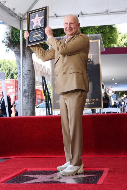 Illumination founder and CEO Chris Meledandri poses next to his newly unveiled Hollywood Walk of Fame star during a ceremony in Hollywood, California, on June 10, 2026. (Photo by VALERIE MACON / AFP)