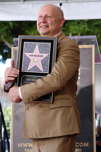 Illumination founder and CEO Chris Meledandri poses next to his newly unveiled Hollywood Walk of Fame star during a ceremony in Hollywood, California, on June 10, 2026. (Photo by VALERIE MACON / AFP)