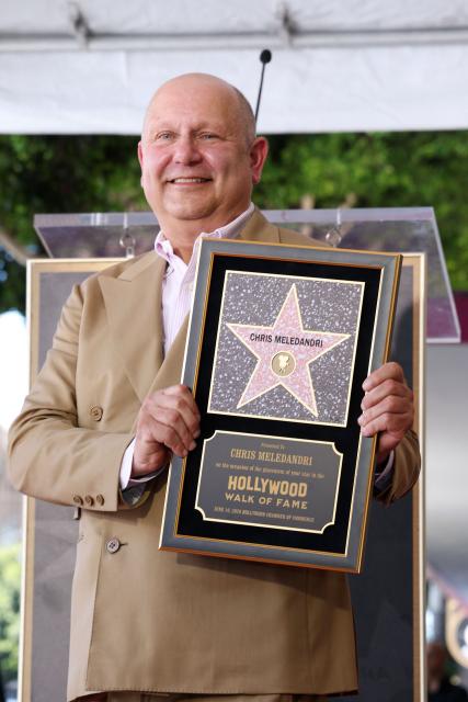 Illumination founder and CEO Chris Meledandri poses next to his newly unveiled Hollywood Walk of Fame star during a ceremony in Hollywood, California, on June 10, 2026. (Photo by VALERIE MACON / AFP)