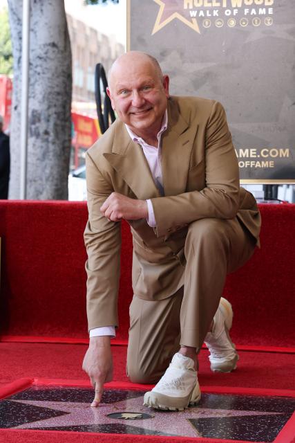 Illumination founder and CEO Chris Meledandri poses next to his newly unveiled Hollywood Walk of Fame star during a ceremony in Hollywood, California, on June 10, 2026. (Photo by VALERIE MACON / AFP)