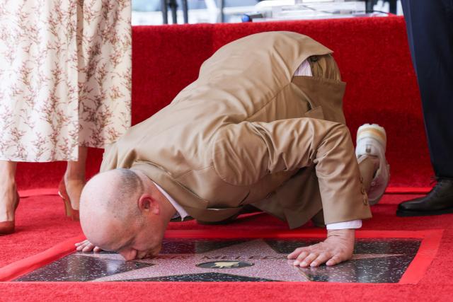 Illumination founder and CEO Chris Meledandri kisses his newly unveiled Hollywood Walk of Fame star during a ceremony in Hollywood, California, on June 10, 2026. (Photo by VALERIE MACON / AFP)