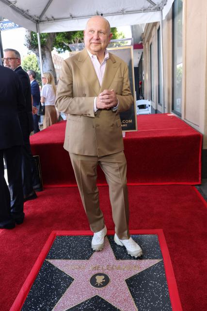 Illumination founder and CEO Chris Meledandri poses next to his newly unveiled Hollywood Walk of Fame star during a ceremony in Hollywood, California, on June 10, 2026. (Photo by VALERIE MACON / AFP)