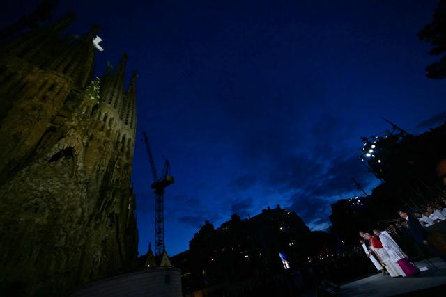 Pope Leo XIV blesses Sagrada Familia's Jesus Christ tower during its inauguration in Barcelona, on June 10, 2026. Pope Leo XIV is visiting Spain June 6-12 with stops in Madrid, Barcelona, and the Canary Islands, where he will meet with migrants and organisations dedicated to helping them. (Photo by Stefano RELLANDINI / AFP)