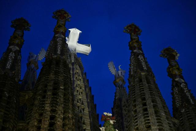 A photo taken in Barcelona, on June 10, 2026 shows a view of the illuminated Basilica of the Sagrada Familia's Jesus Christ tower during the inauguration of Jesus Christ tower by Pope Leo XIV. Pope Leo XIV is visiting Spain June 6-12 with stops in Madrid, Barcelona, and the Canary Islands, where he will meet with migrants and organisations dedicated to helping them. (Photo by Stefano RELLANDINI / AFP)