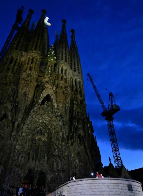 Pope Leo XIV blesses the Sagrada Familia's Jesus Christ tower during its inauguration in Barcelona, on June 10, 2026. Pope Leo XIV is visiting Spain June 6-12 with stops in Madrid, Barcelona, and the Canary Islands, where he will meet with migrants and organisations dedicated to helping them. (Photo by Stefano RELLANDINI / AFP)