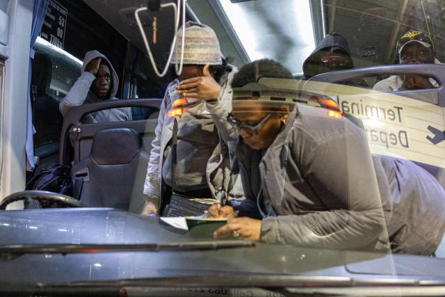 Nigerian nationals, who will be part of the first evacuation flight for Lagos, have their identities checked before entering the OR Tambo International Airport, in Johannesburg on June 10, 2026. The first batch of Nigerian nationals board an Air Peace Airlines evacuation flight chartered by the Federal Government of Nigeria, departing for Lagos amid a wave of xenophobic attacks in South Africa. Hundreds of anti-migrant protesters marched through a township outside Johannesburg on June 8, 2026, a day after South African President Cyril Ramaphosa pledged action against groups accused of fuelling xenophobic violence. South Africa has seen recurring bouts of anti-migrant violence, with protests intensifying this year after vigilante groups ordered undocumented foreigners to leave by June 30. (Photo by EMMANUEL CROSET / AFP)