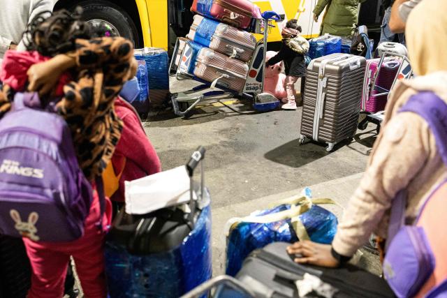Nigerian nationals, who will be part of the first evacuation flight for Lagos, gather their belongings in front of the OR Tambo International Airport, in Johannesburg on June 10, 2026. The first batch of Nigerian nationals board an Air Peace Airlines evacuation flight chartered by the Federal Government of Nigeria, departing for Lagos amid a wave of xenophobic attacks in South Africa. Hundreds of anti-migrant protesters marched through a township outside Johannesburg on June 8, 2026, a day after South African President Cyril Ramaphosa pledged action against groups accused of fuelling xenophobic violence. South Africa has seen recurring bouts of anti-migrant violence, with protests intensifying this year after vigilante groups ordered undocumented foreigners to leave by June 30. (Photo by EMMANUEL CROSET / AFP)