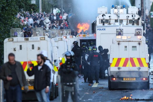 Police use water cannon and block the road from protesters leading to a hotel previously believed to house migrants, in Glengormley, north of Belfast, Northern Ireland, on June 10, 2026. Northern Ireland braced on June 10 for a potential second night of violence directed at immigrants, following unrest that UK authorities say was stoked by far-right activists on social media after a brutal Belfast stabbing. (Photo by Paul Faith / AFP)