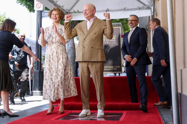 Chairwoman of NBCUniversal Studios & Entertainment Donna Langley (L) and US actor Steve Carell (R) pose with Illumination founder and CEO Chris Meledandri next to his newly unveiled Hollywood Walk of Fame star during a ceremony in Hollywood, California, on June 10, 2026. (Photo by VALERIE MACON / AFP)