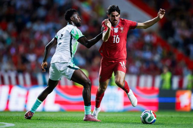 Nigeria's midfielder #04 Onyinye Ndidi and Portugal's forward #16 Francisco Trincao fight for the ball during the international friendly football match between Portugal and Nigeria at Magalhaes Pessoa Stadium in Leiria, on June 10, 2026. (Photo by FILIPE AMORIM / AFP)