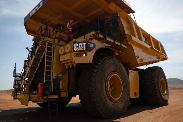 Workers test heavy machinery tires at Michelin Experience Center in Almeria on June 10, 2026. Michelin at the Almeria's Experience Center tests its prototypes, innovations and its special tires bound to face harsh competition, including from China. (Photo by JORGE GUERRERO / AFP)