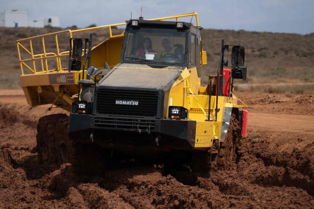 Workers test heavy machinery tires at Michelin Experience Center in Almeria on June 10, 2026. Michelin at the Almeria's Experience Center tests its prototypes, innovations and its special tires bound to face harsh competition, including from China. (Photo by JORGE GUERRERO / AFP)