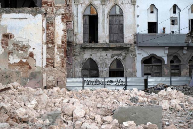 Debris from a demolished house occupies part of the seaside promenade in the Centro Habana neighborhood, in Havana on June 9, 2026. The United Nations High Commissioner for Human Rights on June 8, 2026, urged the United States to "immediately" lift the sanctions that have been accumulating against Cuba since January. "Fuel restrictions imposed since early 2026 and the recent tightening of extraterritorial sanctions are directly harming Cubans, particularly the most vulnerable," Volker Turk said in a statement. (Photo by Pablo PORCIUNCULA / AFP)