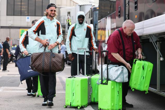 France's midfielder #14 Adrien Rabiot (L) and forward #09 Marcus Thuram arrive at Logan Aeropuerto Internacional in Boston, Massachusetts on June 10 2026, ahead of the FIFA 2026 World Cup football tournament. (Photo by Franck FIFE / AFP)