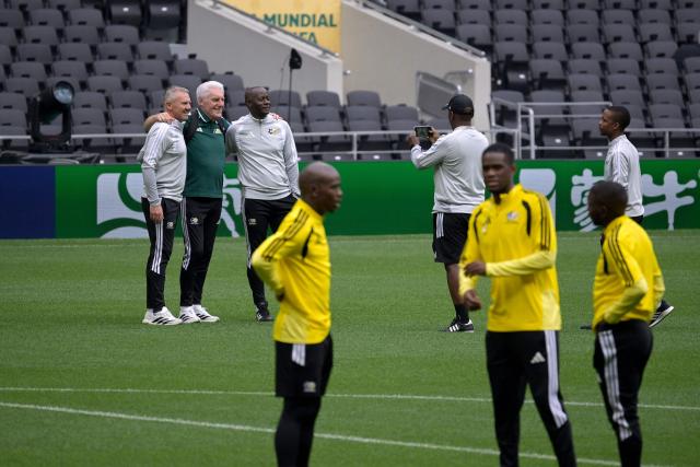 South Africa's Belgian head coach Hugo Broos (2nd-L) poses for a picture with staff members during a pitch recognition at the Mexico City Stadium in Mexico City on June 10, 2026, on the eve of the 2026 World Cup football match between Mexico and South Africa. (Photo by Alfredo ESTRELLA / AFP)