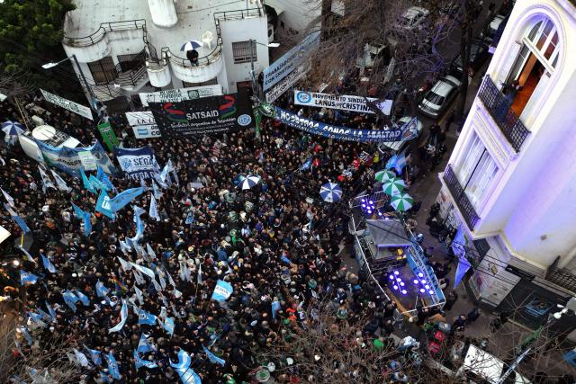 Aerial view as former Argentine president (2007–2015) Cristina Kirchner appears in the balcony of her home as she remains under house arrest in Buenos Aires on June 10, 2026. Kirchner marks her first year since being sentenced to six years in prison and banned from holding public office for life. (Photo by Luis ROBAYO / AFP)