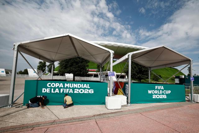 Workers set up frame tents outside the Guadalajara Stadium in Zapopan, Mexico on June 10, 2026, on the eve of the 2026 World Cup football match between South Korea and the Czech Republic. (Photo by Ulises Ruiz / AFP)