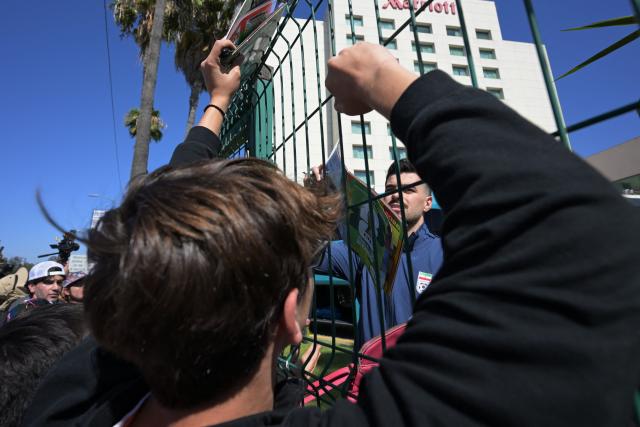 Iran's midfielder  Saeid Ezatolahi signs autographs for fans outside the Marriott Hotel before leaving for a training session in Tijuana, Mexico, on June 10, 2026, ahead of the 2026 FIFA World Cup football tournament. (Photo by Guillermo Arias / AFP)