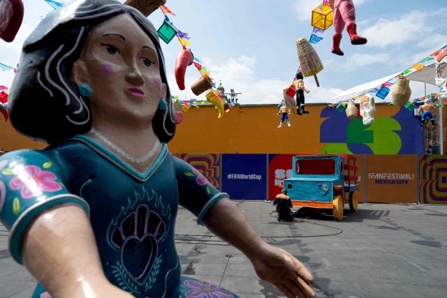 A view of the FIFA Fan Fest installations at Zocalo Square, one day before the opening of the 2026 FIFA World Cup football tournament in Mexico City on June 10, 2026. (Photo by Gerardo LUNA / AFP)
