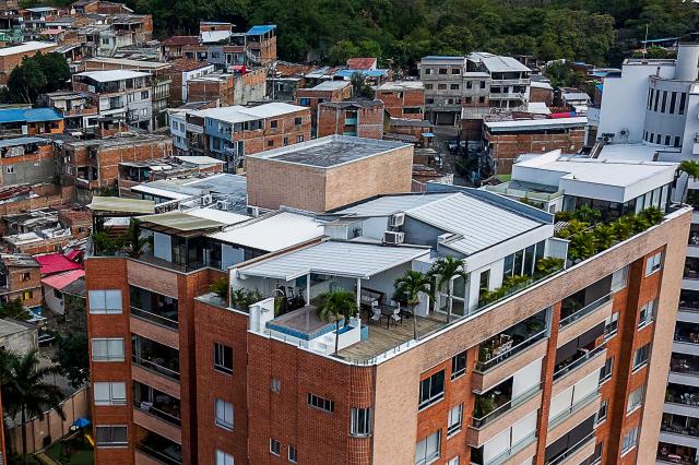 Aerial view of the Santa Terisista and Mameyal neighbourhoods in the western region of Cali, Colombia on June 10, 2026. (Photo by JOAQUIN SARMIENTO / AFP)