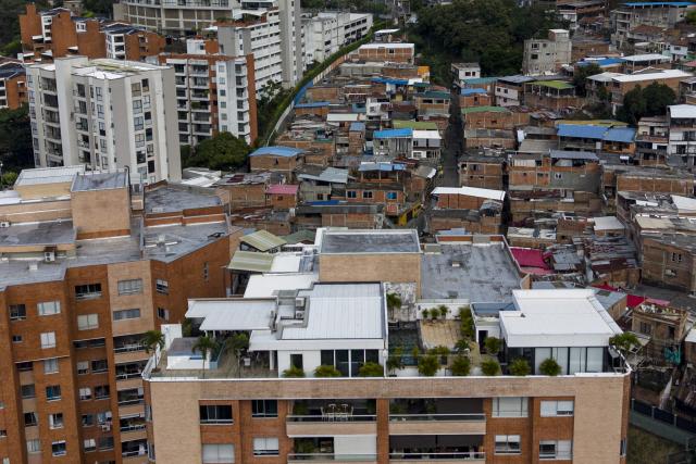 Aerial view of the Santa Terisista and Mameyal neighbourhoods in the western region of Cali, Colombia on June 10, 2026. (Photo by JOAQUIN SARMIENTO / AFP)