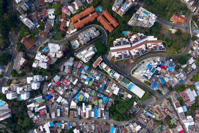 Aerial view of the Santa Terisista and Mameyal neighbourhoods in the western region of Cali, Colombia on June 10, 2026. (Photo by JOAQUIN SARMIENTO / AFP)