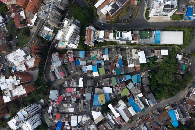Aerial view of the Santa Terisista and Mameyal neighbourhoods in the western region of Cali, Colombia on June 10, 2026. (Photo by JOAQUIN SARMIENTO / AFP)