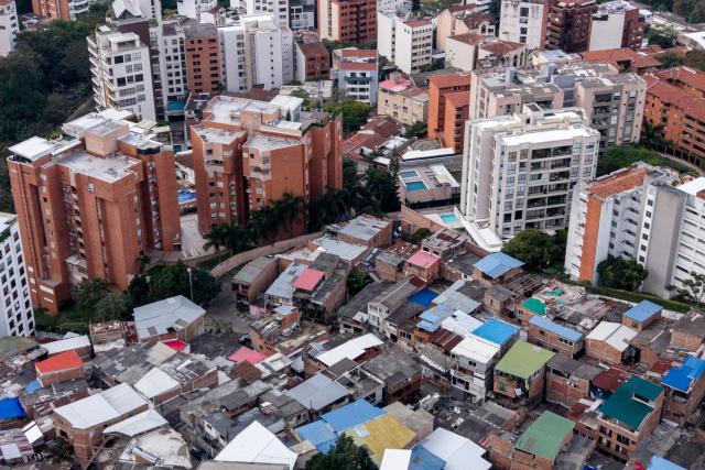 Aerial view of the Santa Terisista and Mameyal neighbourhoods in the western region of Cali, Colombia on June 10, 2026. (Photo by JOAQUIN SARMIENTO / AFP)