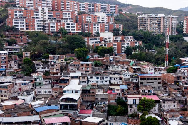 Aerial view of the Siloe and Cristales neighbourhoods in the western region of Cali, Colombia on June 10, 2026. (Photo by JOAQUIN SARMIENTO / AFP)