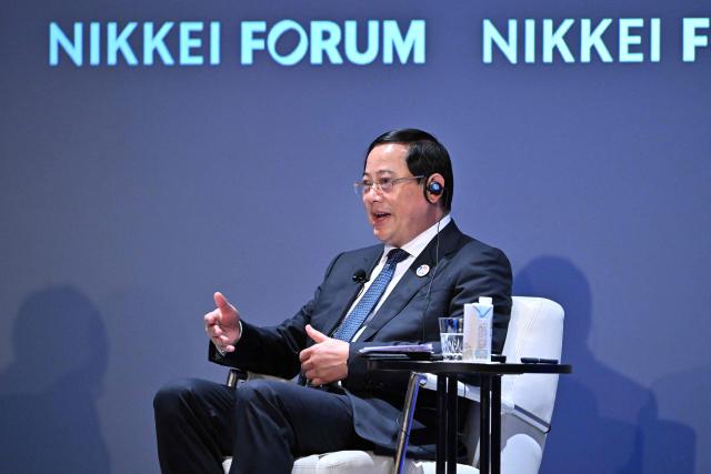 Laos' Prime Minister Sonexay Siphandone speaks during the Nikkei Forum in Tokyo on June 11, 2026. (Photo by Kazuhiro NOGI / AFP)