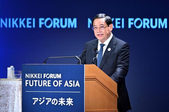 Laos' Prime Minister Sonexay Siphandone speaks during the Nikkei Forum in Tokyo on June 11, 2026. (Photo by Kazuhiro NOGI / AFP)