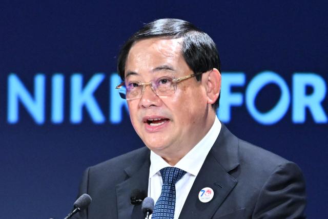 Laos' Prime Minister Sonexay Siphandone speaks during the Nikkei Forum in Tokyo on June 11, 2026. (Photo by Kazuhiro NOGI / AFP)