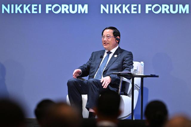 Laos' Prime Minister Sonexay Siphandone speaks during the Nikkei Forum in Tokyo on June 11, 2026. (Photo by Kazuhiro NOGI / AFP)