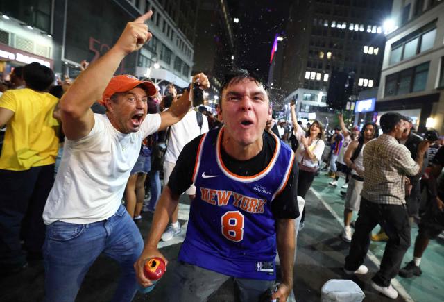 New York Knicks fans celebrate outside Madison Square Garden after their team’s Game 4 victory over the San Antonio Spurs in the NBA Finals in New York on June 10, 2026. (Photo by CHARLY TRIBALLEAU / AFP)