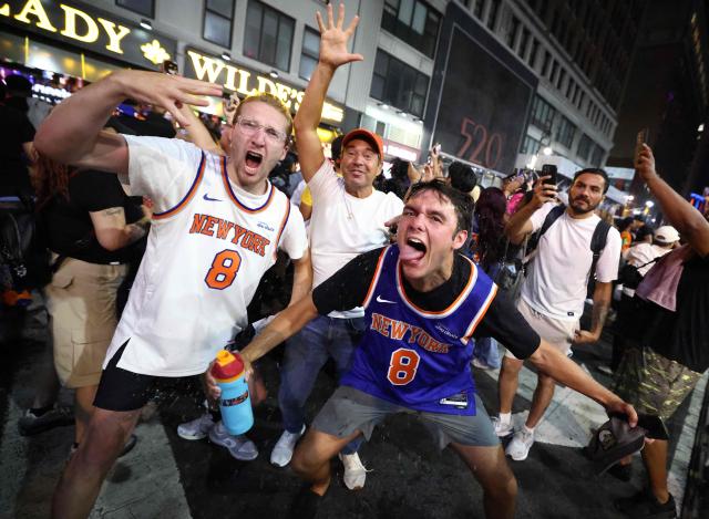 New York Knicks fans celebrate outside Madison Square Garden after their team’s Game 4 victory over the San Antonio Spurs in the NBA Finals in New York on June 10, 2026. (Photo by CHARLY TRIBALLEAU / AFP)