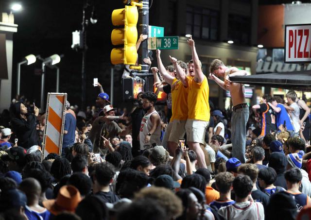 New York Knicks fans celebrate outside Madison Square Garden after their team’s Game 4 victory over the San Antonio Spurs in the NBA Finals in New York on June 10, 2026. (Photo by CHARLY TRIBALLEAU / AFP)